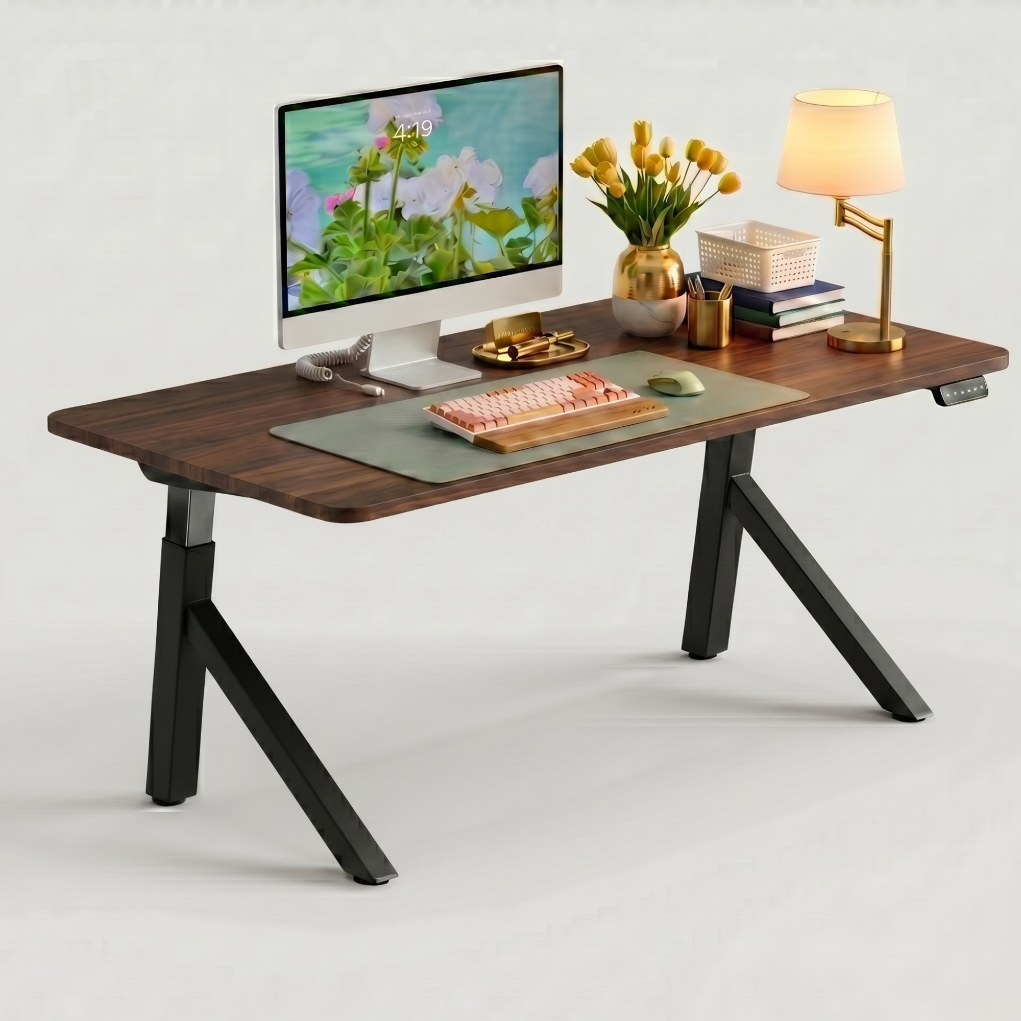 FlowDesk Aero black frame lifestyle setup with iMac, yellow tulips, desk lamp, keyboard and accessories in home office