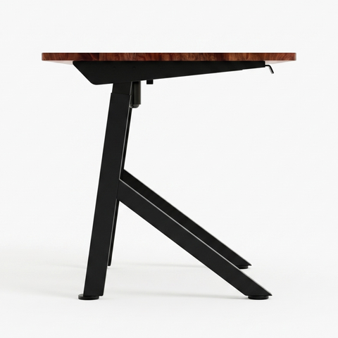 FlowDesk Aero black frame side-profile close-up of open Y-leg, diagonal brace and electric height adjustment mechanism