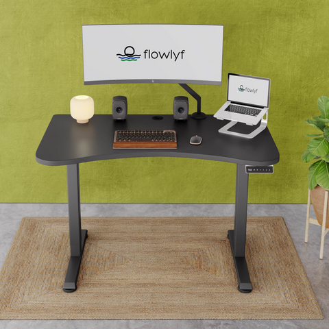 FlowDesk GO 2-stage single motor standing desk with black engineered wood table top and grey finish frame with stable ergonomic design
