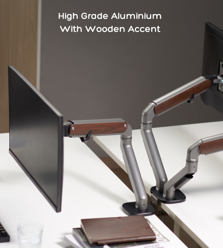 FlowArm monitor arm in clean ergonomic desk setup with laptop stand and keyboard, India