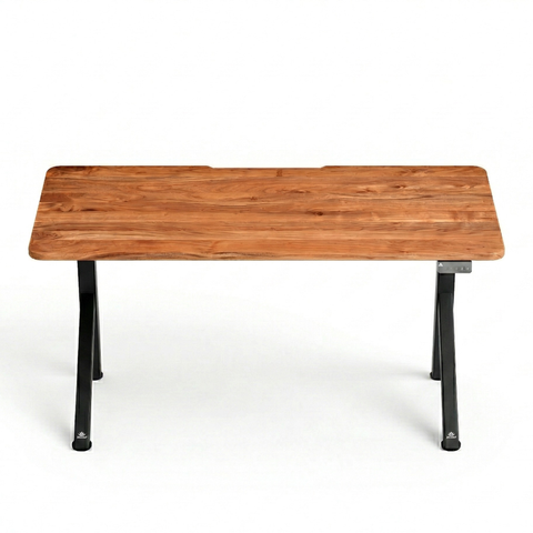 FlowDesk Aero black frame height adjustable desk, warm natural acacia tabletop — front view showing open Y-leg profile